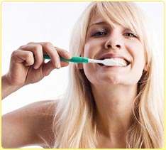 stock photo of woman brushing her teeth